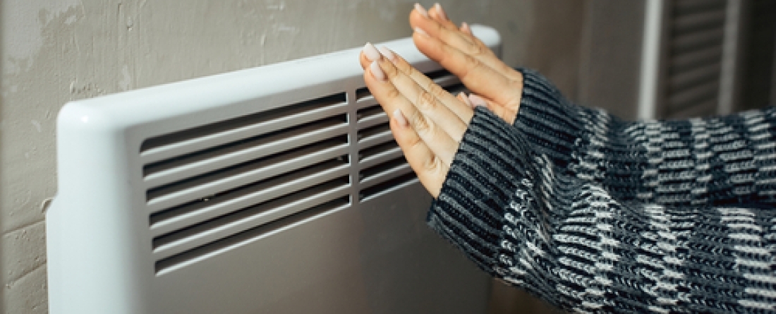 woman in front of heating