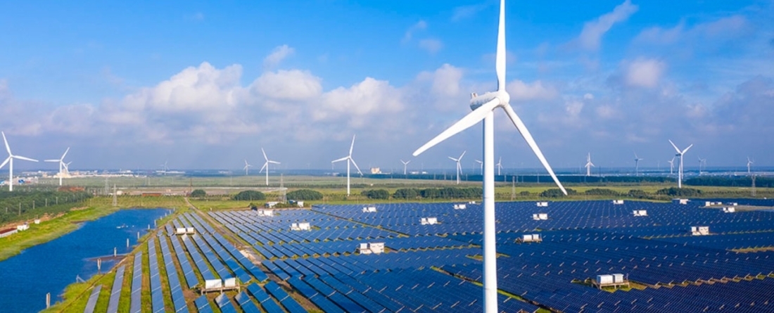 picture of solar panels and wind farm